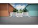 Handicap parking spaces leading to a community courtyard with access gates at 1420 Beach Rd # 203, Englewood, FL 34223