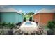 Inviting community pool with poolside seating and mature landscaping at 1420 Beach Rd # 203, Englewood, FL 34223