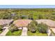 Scenic aerial shot showcasing a home's layout, landscaping, and proximity to natural surroundings at 14270 Reserve Ct, Port Charlotte, FL 33953