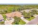 Beautifully landscaped home with a well-manicured lawn and a spacious driveway leading to the garage at 14270 Reserve Ct, Port Charlotte, FL 33953