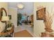 Open foyer leading into the living room, featuring tile flooring and natural light at 14270 Reserve Ct, Port Charlotte, FL 33953