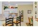 Charming kitchen with white cabinetry, decorative accents, and a cozy breakfast bar area at 14270 Reserve Ct, Port Charlotte, FL 33953