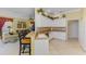 Open kitchen view with breakfast bar seating and seamless transition to the inviting living area at 14270 Reserve Ct, Port Charlotte, FL 33953