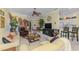 Inviting living room with comfortable seating, warm colors, and ample natural light at 14270 Reserve Ct, Port Charlotte, FL 33953