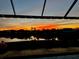 Amazing backyard sunset view with palm trees from covered patio at 14286 Fort Worth Cir, Port Charlotte, FL 33981