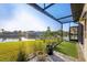 Waterfront backyard with lush lawn and beautiful scenery, perfect for relaxation at 14286 Fort Worth Cir, Port Charlotte, FL 33981