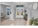 Welcoming foyer with tiled flooring and glass double doors, creating an elegant entrance at 14286 Fort Worth Cir, Port Charlotte, FL 33981