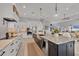 Modern kitchen with an island, stainless steel appliances, and open layout to living room ideal for entertaining at 14286 Fort Worth Cir, Port Charlotte, FL 33981
