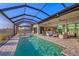 Inviting pool with screened lanai offering seamless indoor-outdoor living and dining at 14286 Fort Worth Cir, Port Charlotte, FL 33981