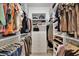 Well-organized walk-in closet featuring ample shelving and hanging space for clothes, shoes, and accessories at 14286 Fort Worth Cir, Port Charlotte, FL 33981
