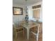 Elegant dining area with a glass-top table and seating for four at 150 Englewood Isles Pkwy # 201, Englewood, FL 34223
