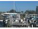 Dock with multiple boat lifts offering a convenient way to access the water at 150 Englewood Isles Pkwy # 201, Englewood, FL 34223