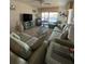 Spacious living area with water views and comfortable seating arrangements at 150 Englewood Isles Pkwy # 201, Englewood, FL 34223