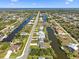 Stunning aerial view of a community with waterfront properties, canals, and coastal access at 15251 Appleton Blvd, Port Charlotte, FL 33981