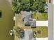 Aerial view of the property with lush landscaping and waterfront access at 15251 Appleton Blvd, Port Charlotte, FL 33981