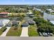 Aerial view of the home nestled in a waterfront community with canals and boat docks at 15251 Appleton Blvd, Port Charlotte, FL 33981