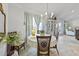 Bright dining area with stylish chandelier, round table, and comfortable chairs at 15251 Appleton Blvd, Port Charlotte, FL 33981