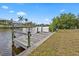 Private dock along a serene canal providing waterfront access and relaxation at 15251 Appleton Blvd, Port Charlotte, FL 33981