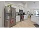 Kitchen featuring stainless steel appliances, white cabinets and granite countertops at 15251 Appleton Blvd, Port Charlotte, FL 33981