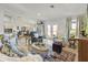 Open-concept living area with tile flooring, a dining area, and ample natural light at 15251 Appleton Blvd, Port Charlotte, FL 33981