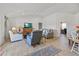 Bright and airy living room with wood-look tile flooring, neutral decor, and an open layout at 15251 Appleton Blvd, Port Charlotte, FL 33981