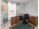 Office space with light streaming through the windows and hardwood desk and cabinetry at 15251 Appleton Blvd, Port Charlotte, FL 33981