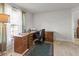 Bright office with wood desk and neutral walls, ideal for working at home at 15251 Appleton Blvd, Port Charlotte, FL 33981