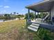 Waterfront home with a covered patio steps away from a canal and private dock at 15251 Appleton Blvd, Port Charlotte, FL 33981