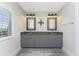 Well-lit bathroom featuring double sinks, granite countertops, modern fixtures, and a bright window at 15738 Applewhite Cir, Port Charlotte, FL 33981