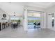 Open-concept dining room with waterfront views and access to the patio at 15738 Applewhite Cir, Port Charlotte, FL 33981