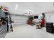 Spacious garage features ample storage, work space, and overhead lighting at 15738 Applewhite Cir, Port Charlotte, FL 33981