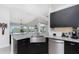 Modern kitchen featuring stainless steel appliances, granite countertops and an open design for casual dining at 15738 Applewhite Cir, Port Charlotte, FL 33981