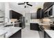 Modern kitchen with dark cabinetry, stainless steel appliances, and granite countertops at 15738 Applewhite Cir, Port Charlotte, FL 33981