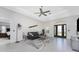 Inviting living room features modern decor and ample natural light from the doors and windows at 15738 Applewhite Cir, Port Charlotte, FL 33981