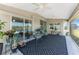 Covered outdoor patio area with tile flooring, ceiling fans and beautiful waterfront views at 15738 Applewhite Cir, Port Charlotte, FL 33981