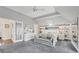 Bright main bedroom with a seating area, built-ins, and a large mirror at 16251 Sunset Pines Cir, Boca Grande, FL 33921