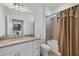 Bathroom featuring granite countertops, and a combined shower and tub at 1758 Saddlewood Cir, Port Charlotte, FL 33953