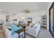 Bright and open living area with tile floors, neutral furniture, and a view of the kitchen at 1758 Saddlewood Cir, Port Charlotte, FL 33953
