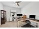 Bright home office with multiple workstations, ceiling fan, and modern decor at 1758 Saddlewood Cir, Port Charlotte, FL 33953