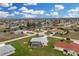 Find this home with a screened pool, mature landscaping and a circular driveway at 2 Bunker Way, Rotonda West, FL 33947