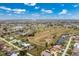 Community aerial view showing the lake and the golf course at 2 Bunker Way, Rotonda West, FL 33947