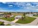 Aerial view of a single-story home in a golf community, with lush green fairways and manicured lawns at 2 Bunker Way, Rotonda West, FL 33947