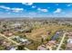Community aerial view showing the lake and the golf course at 2 Bunker Way, Rotonda West, FL 33947