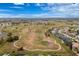 Golf course view featuring manicured fairways, mature trees, and clear blue skies at 2 Bunker Way, Rotonda West, FL 33947