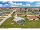 Discover this home with a screened pool, lush lawn, and well-maintained landscaping at 2 Bunker Way, Rotonda West, FL 33947
