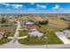 Wide shot of a house and community circled in red, including golf course and waterways at 2 Bunker Way, Rotonda West, FL 33947