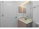 Clean bathroom features marble sink with modern faucet and ample lighting at 2 Bunker Way, Rotonda West, FL 33947