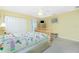 Inviting bedroom features soft carpet, ceiling fan, cozy queen bed with ensuite bathroom access at 2 Bunker Way, Rotonda West, FL 33947