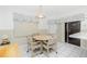 Cozy breakfast nook with a round table, four chairs, and natural light at 2 Bunker Way, Rotonda West, FL 33947