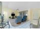 Cozy living room with ceiling fan and neutral carpet at 2 Bunker Way, Rotonda West, FL 33947